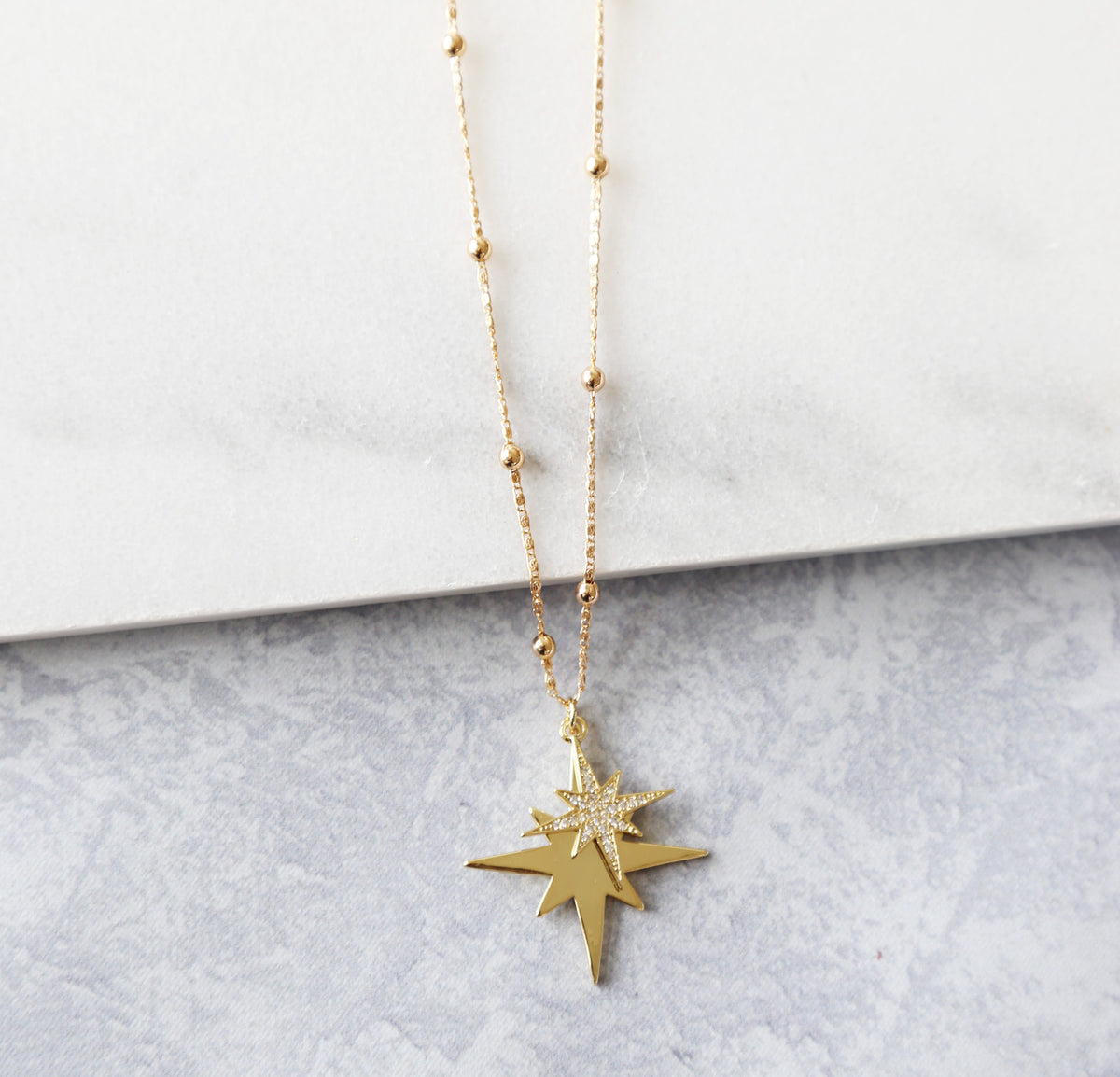 Gold shop star necklace