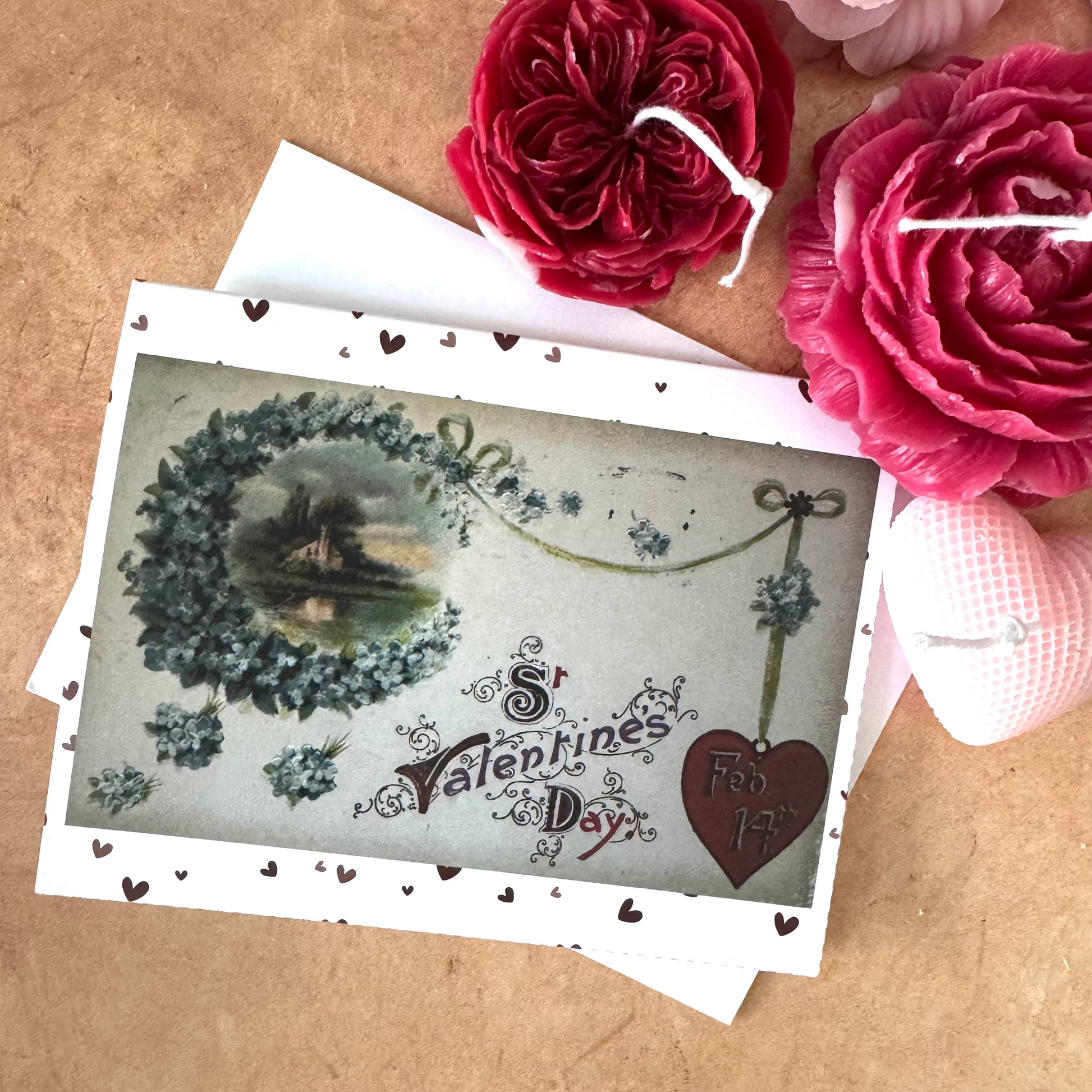 Vintage-style Valentine's Day card with decorative flowers on a brown surface