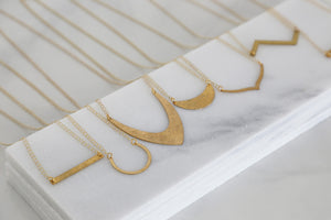 geometric minimal gold necklace