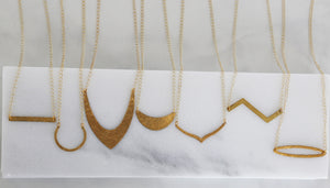 minimal geometric gold necklace
